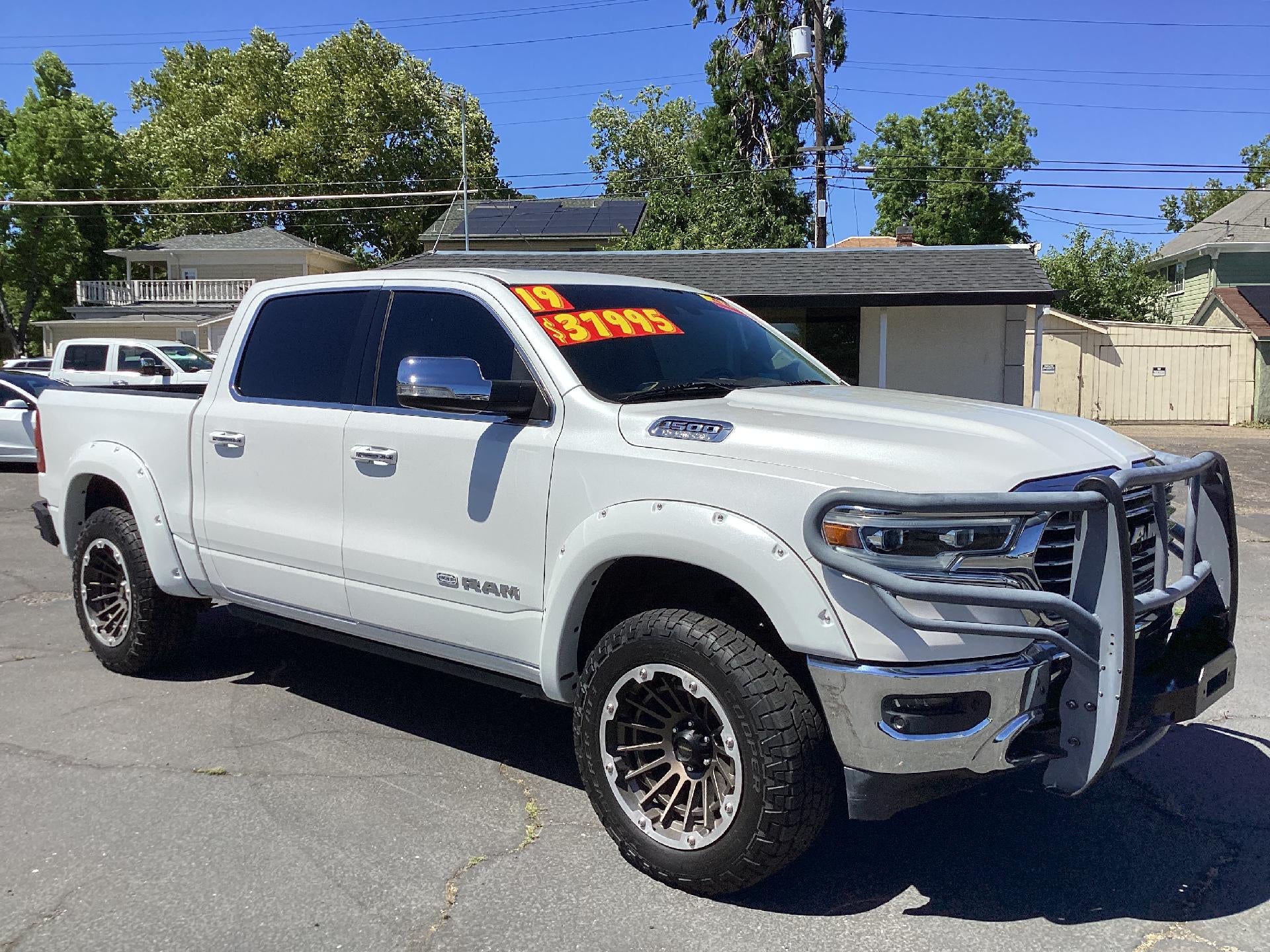 2019 RAM 1500 Longhorn in Diamon White — front three-quarter view