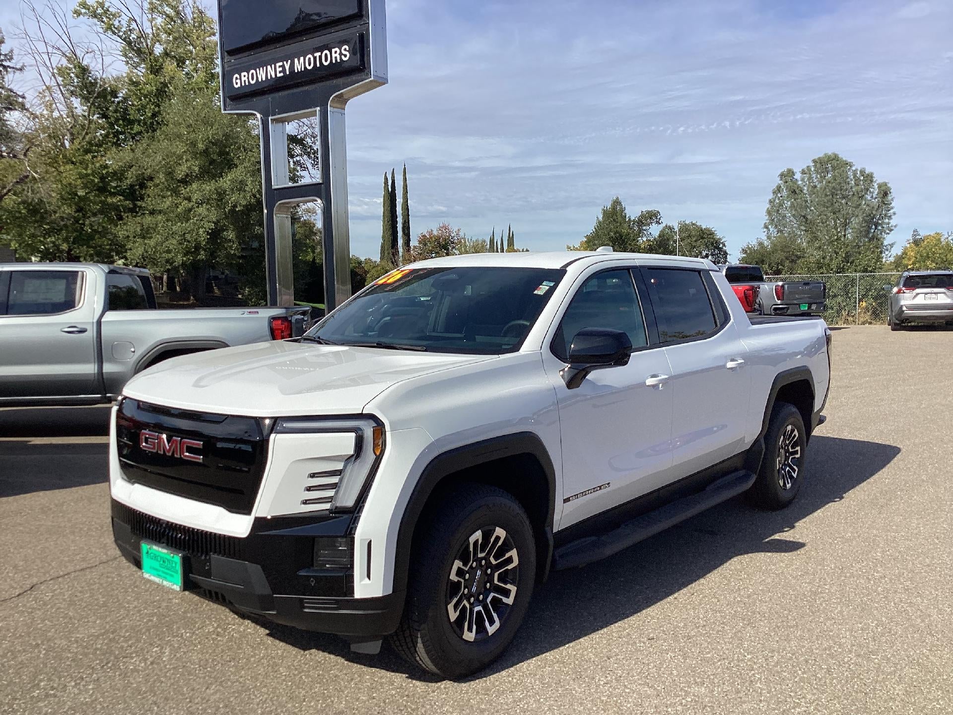 2026 GMC Sierra EV Elevation Standard Range in Summit White — front three-quarter view