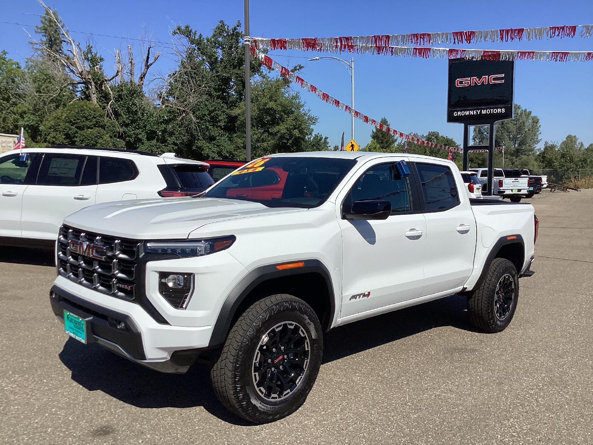 2026 GMC Canyon AT4 in Summit White — front three-quarter view