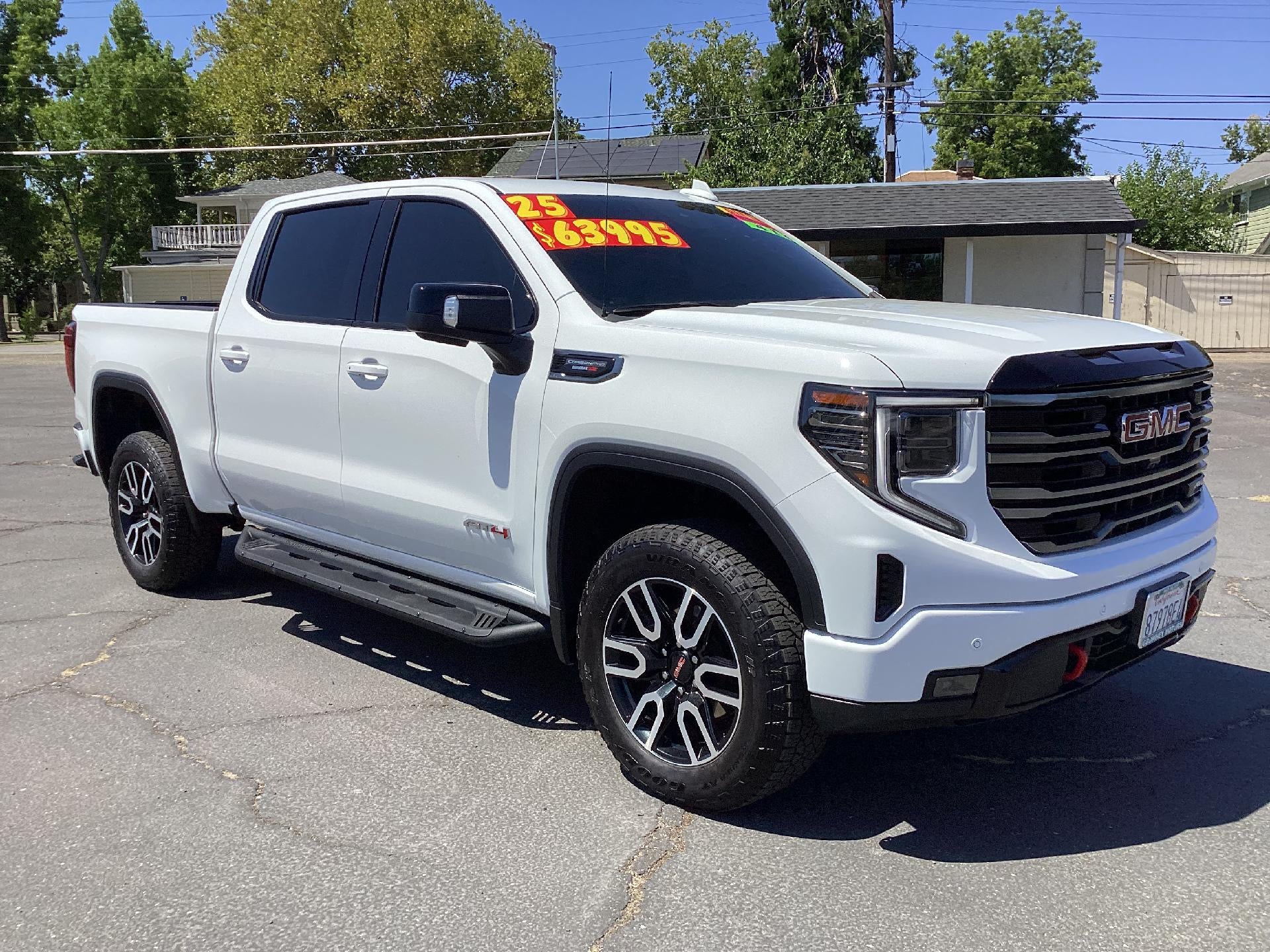 2025 GMC Sierra 1500 AT4 in Summit White — front three-quarter view