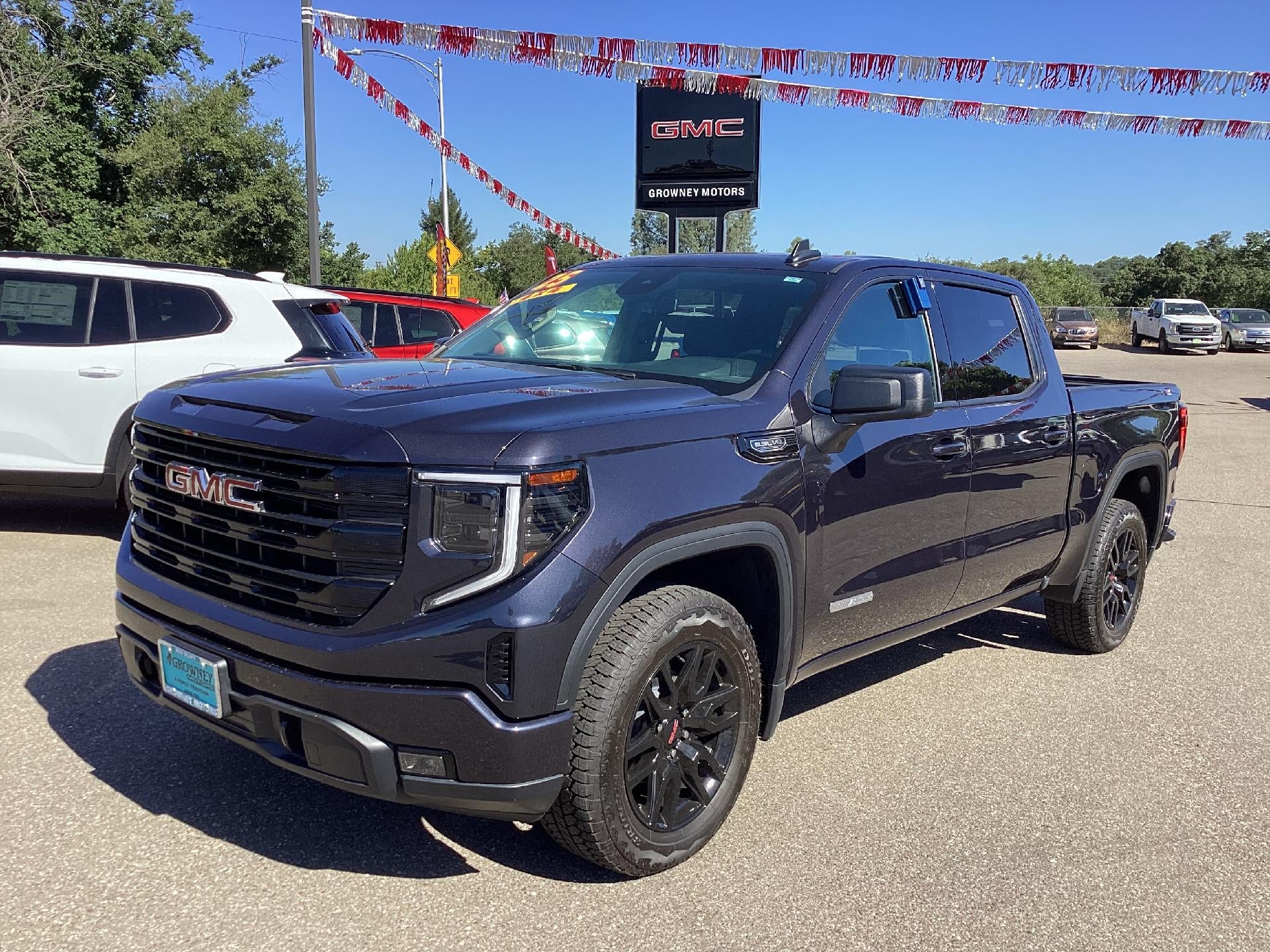 2025 GMC Sierra 1500 Elevation in Titanium Rush Metallic — front three-quarter view
