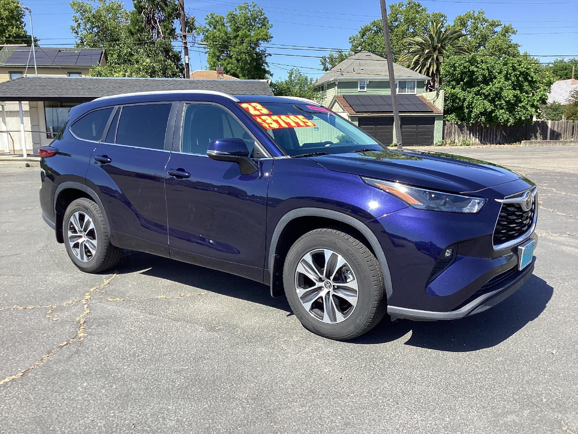 2023 Toyota Highlander L in Blue — front three-quarter view